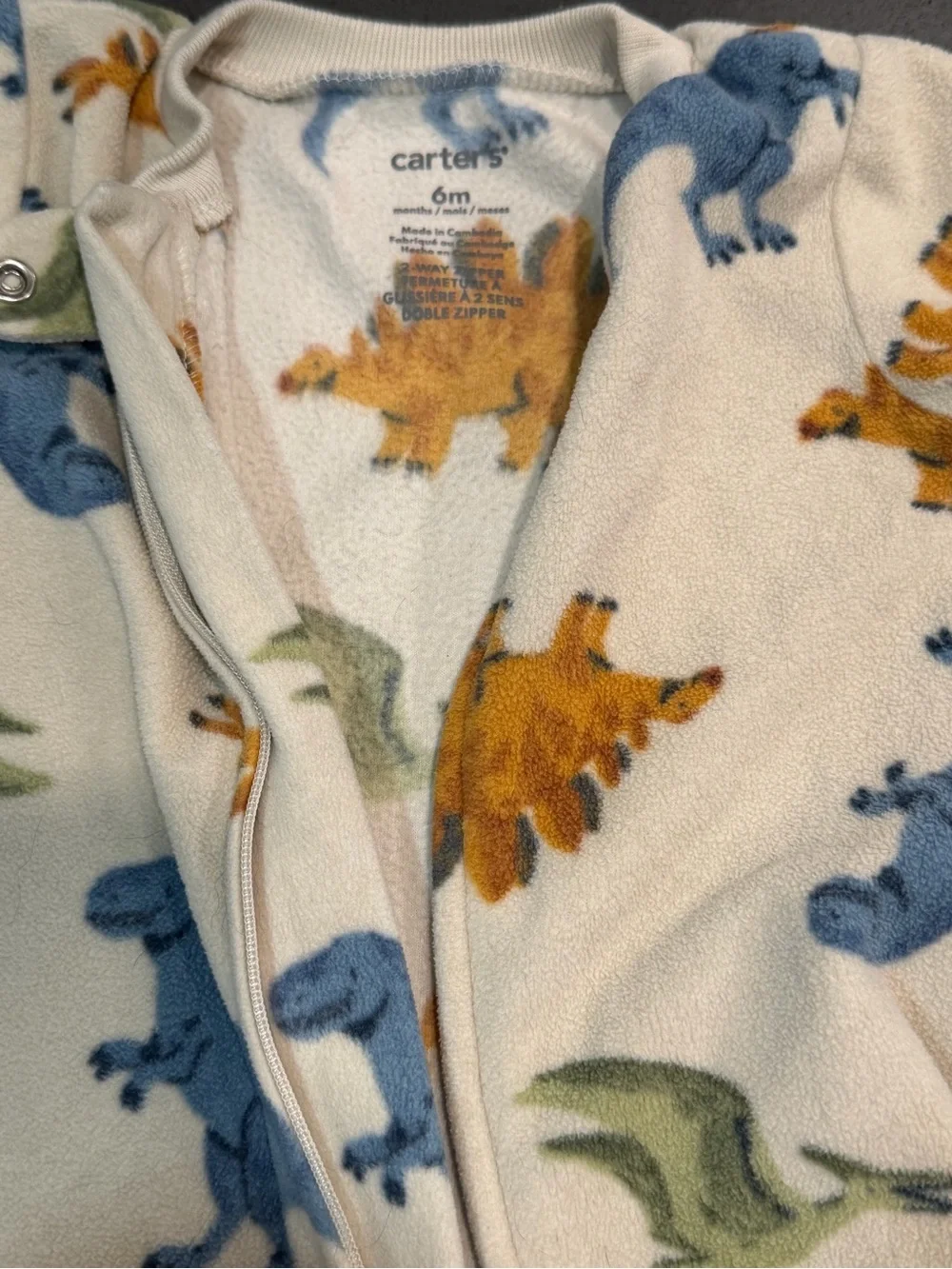Carter's Cream Fleece One-Piece with Blue, Green, and Orange Dinosaurs
